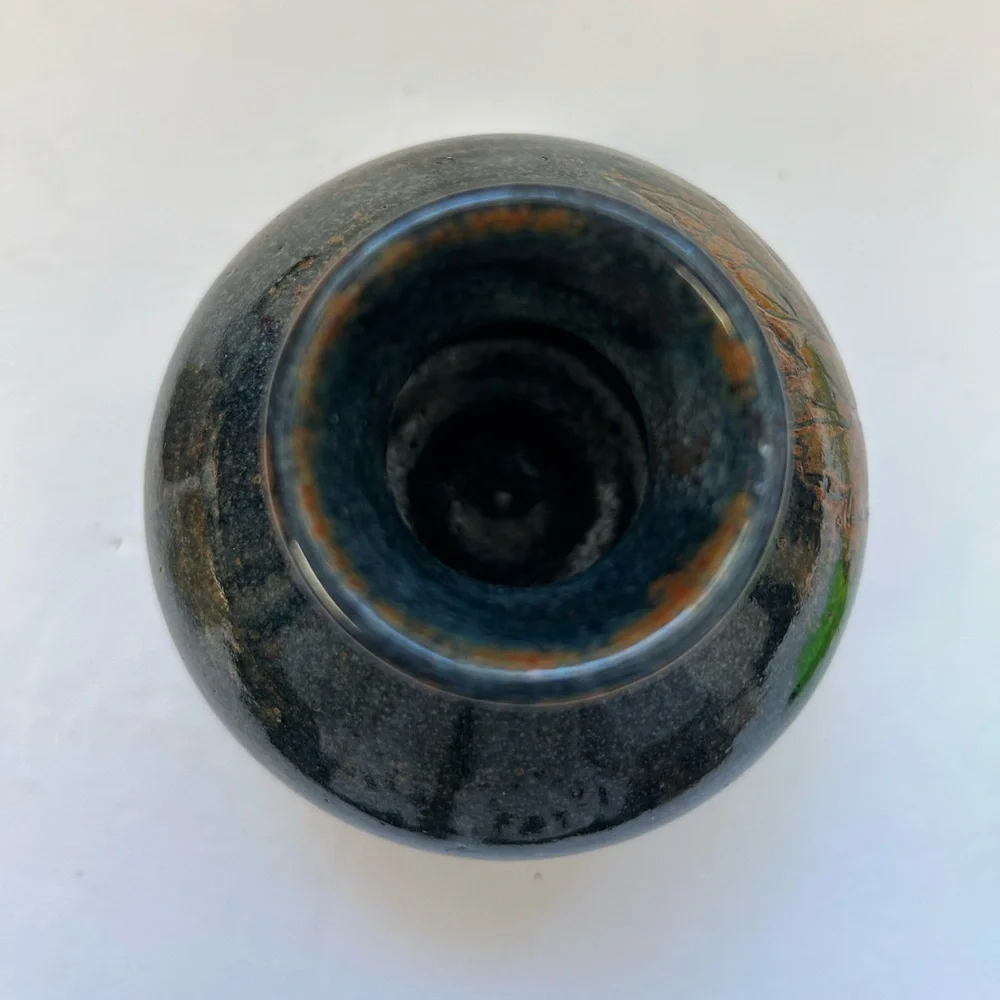 Handmade art pottery vase with a glossy glaze blend of blue and brown/ signed